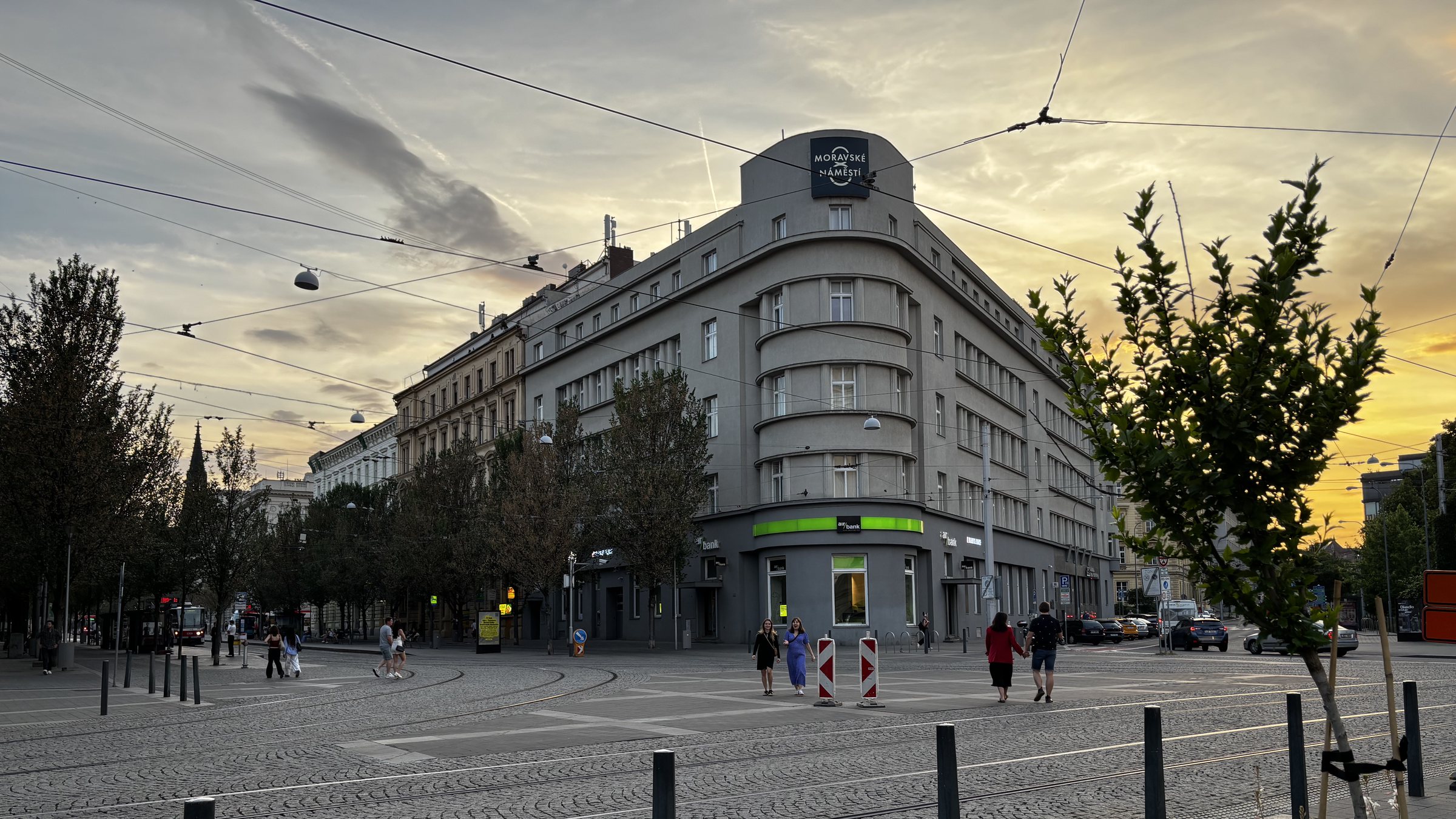 Summer Sunset Bruno. Tram tracks, couples holding hands, friends together, bollards, safety markers, an intersection, street trees and bright green on grey signage. I was drawn to the light and how the clouds intersected the line of the building. Vienna was fantastic but by Brno we were settling into the timezone and being back in summer again.